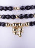 Set de 3 Pulseras de Cuentas de Cristal Negro Azabache y charm de Lazo en Oro Laminado. Elegancia atemporal y envío rápido.