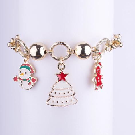 Pulsera dorada con dijes esmaltados colgantes de Muñeco de Nieve, Árbol de Navidad blanco y Galleta de Jengibre.